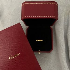 Cartier love ring- thin. Also known as wedding band !